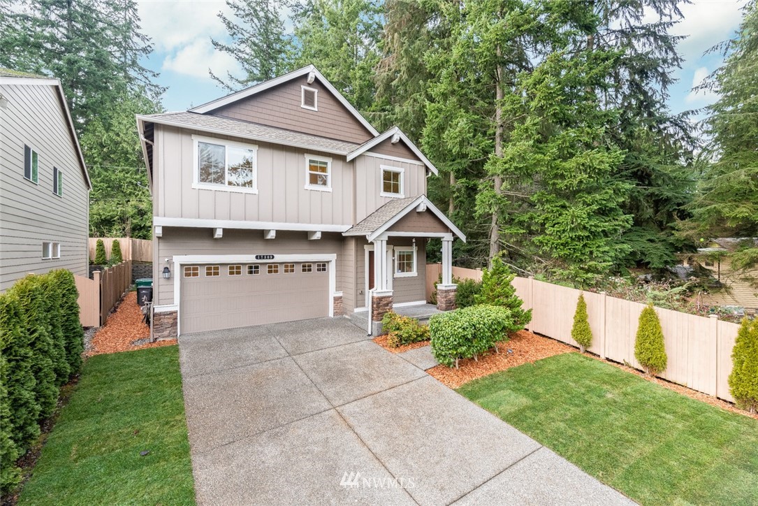 17809 46th Drive Southeast Bothell, WA 98012 - Photo 2 of 35 a front view of a house with a yard and trees