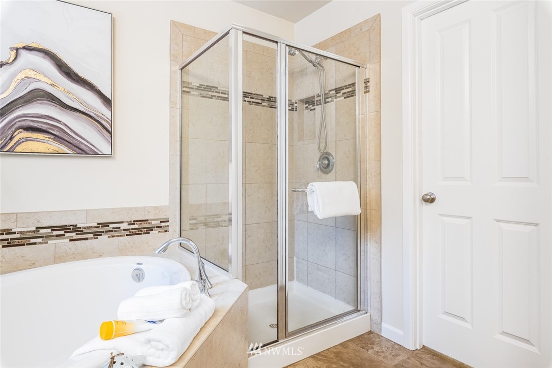 17809 46th Drive Southeast Bothell, WA 98012 - Photo 21 of 35 a bathroom with a tub and a shower