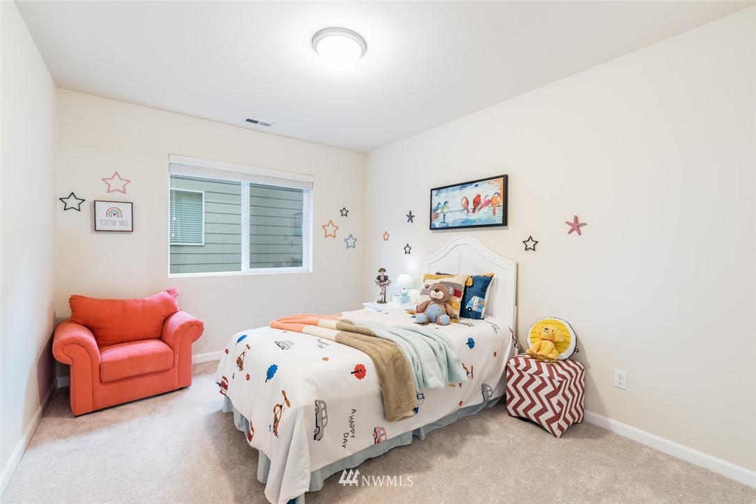 17809 46th Drive Southeast Bothell, WA 98012 - Photo 23 of 35 a bedroom with bed and a couch