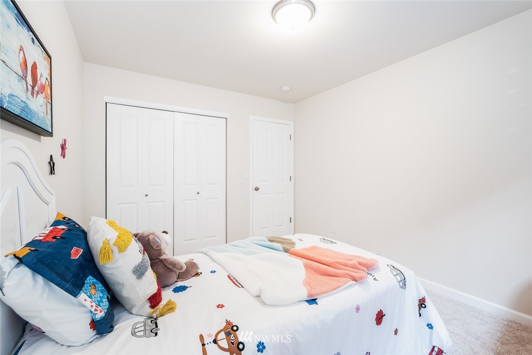 17809 46th Drive Southeast Bothell, WA 98012 - Photo 24 of 35 a bedroom with a bed and a dresser