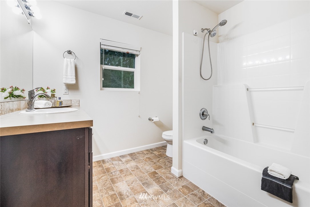 17809 46th Drive Southeast Bothell, WA 98012 - Photo 27 of 35 a bathroom with a sink vanity tub and a shower