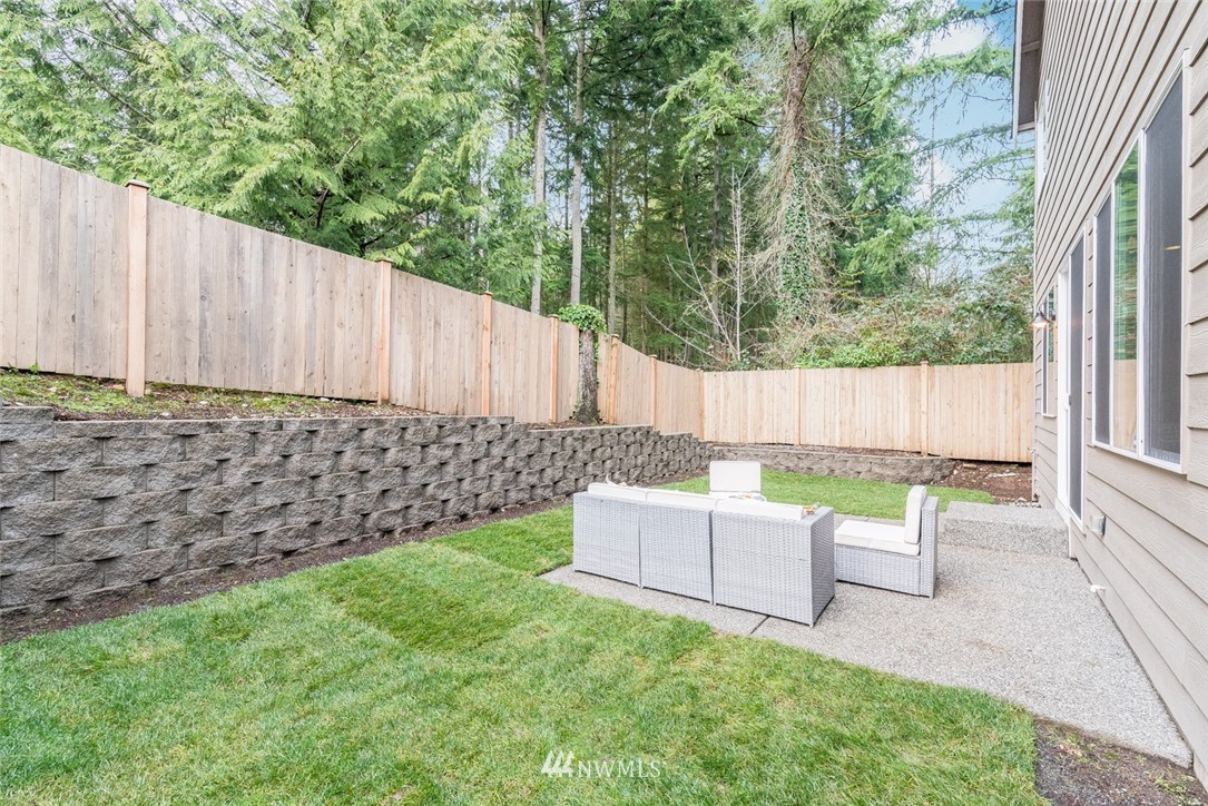 17809 46th Drive Southeast Bothell, WA 98012 - Photo 33 of 35 a backyard of a house with table and chairs