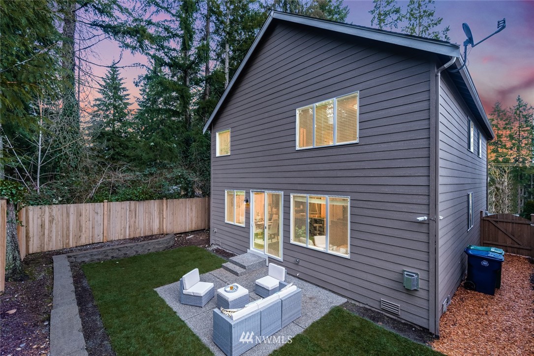 17809 46th Drive Southeast Bothell, WA 98012 - Photo 35 of 35 a view of a small house with a yard plants and large tree