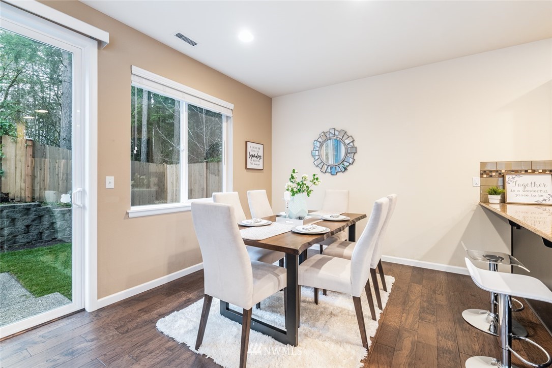 17809 46th Drive Southeast Bothell, WA 98012 - Photo 9 of 35 a view of a dining room with furniture and wooden floor