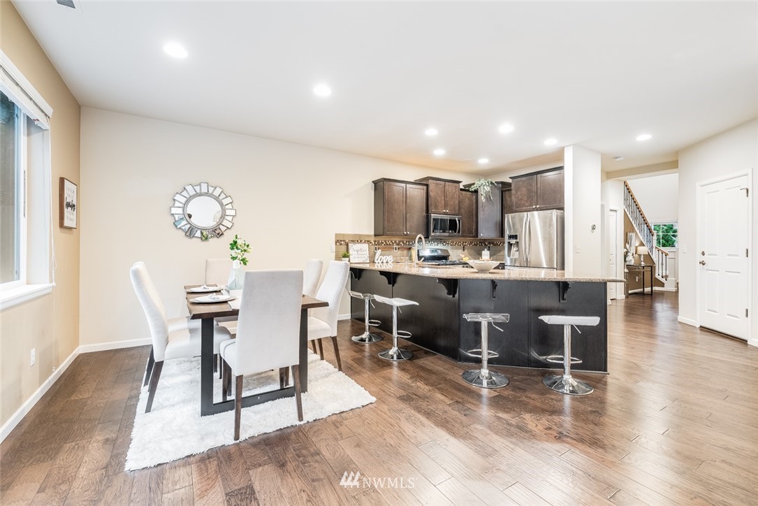 17809 46th Drive Southeast Bothell, WA 98012 - Photo 10 of 35 a view of a dining room kitchen furniture and wooden floor