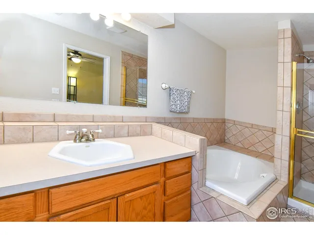 a bathroom with a sink a mirror and a bathtub