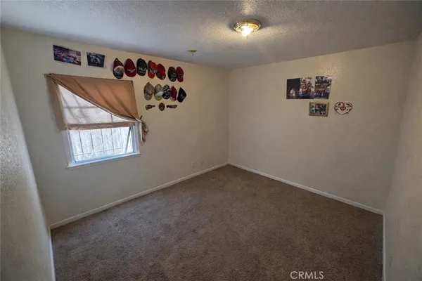 an empty room with a empty space and windows
