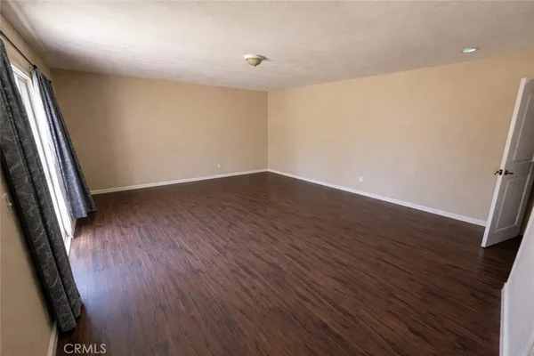 a view of an empty room and window