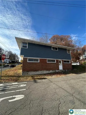a view of house with outdoor space