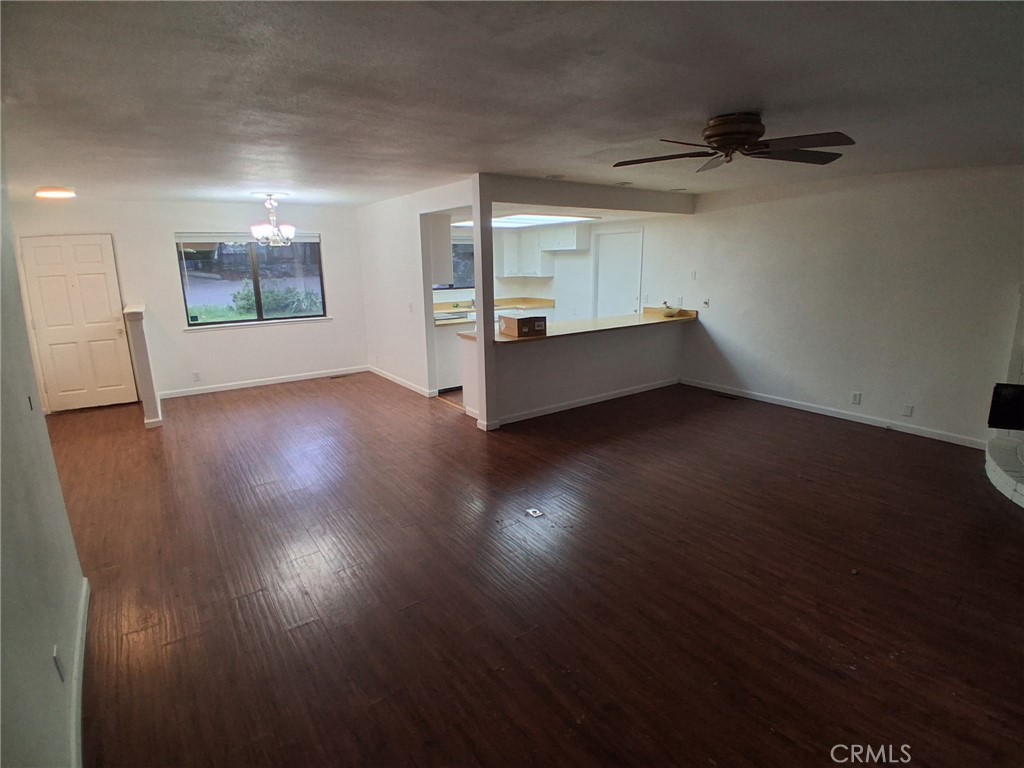 6402 Corning Court Magalia, CA 95954 - Photo 6 of 15 a view of an empty room with wooden floor and a window
