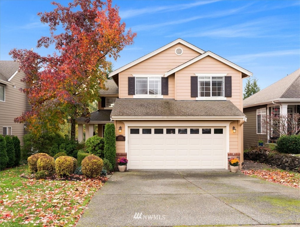 18346 Rainier View Road Southeast Monroe, WA 98272 - Photo 1 of 40 a front view of a house with a yard and garage