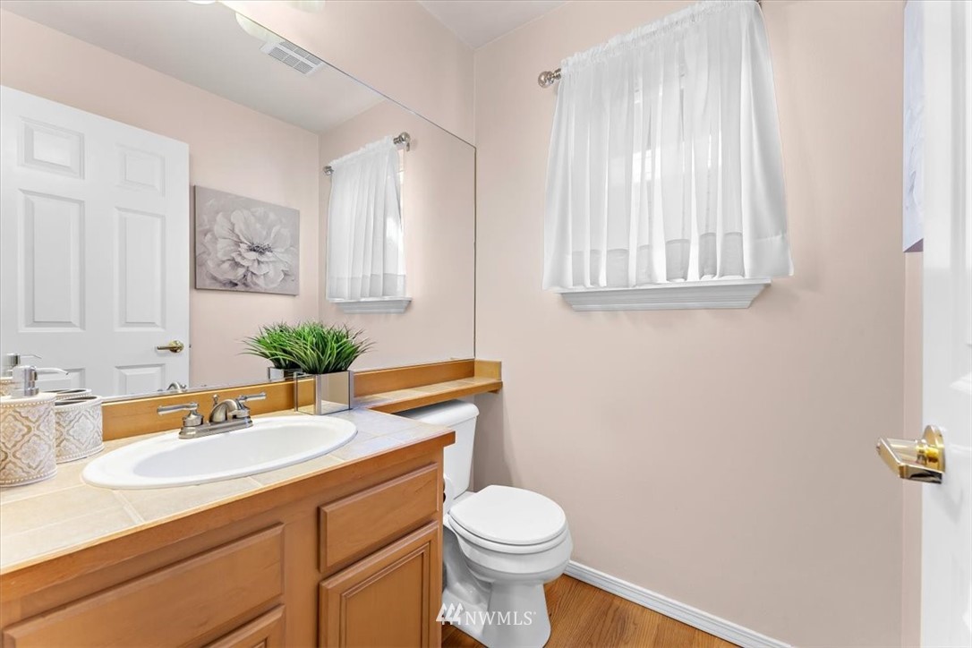 18346 Rainier View Road Southeast Monroe, WA 98272 - Photo 16 of 40 a bathroom with a sink toilet and window