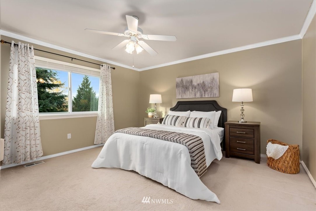 18346 Rainier View Road Southeast Monroe, WA 98272 - Photo 19 of 40 a bedroom with a bed and a window
