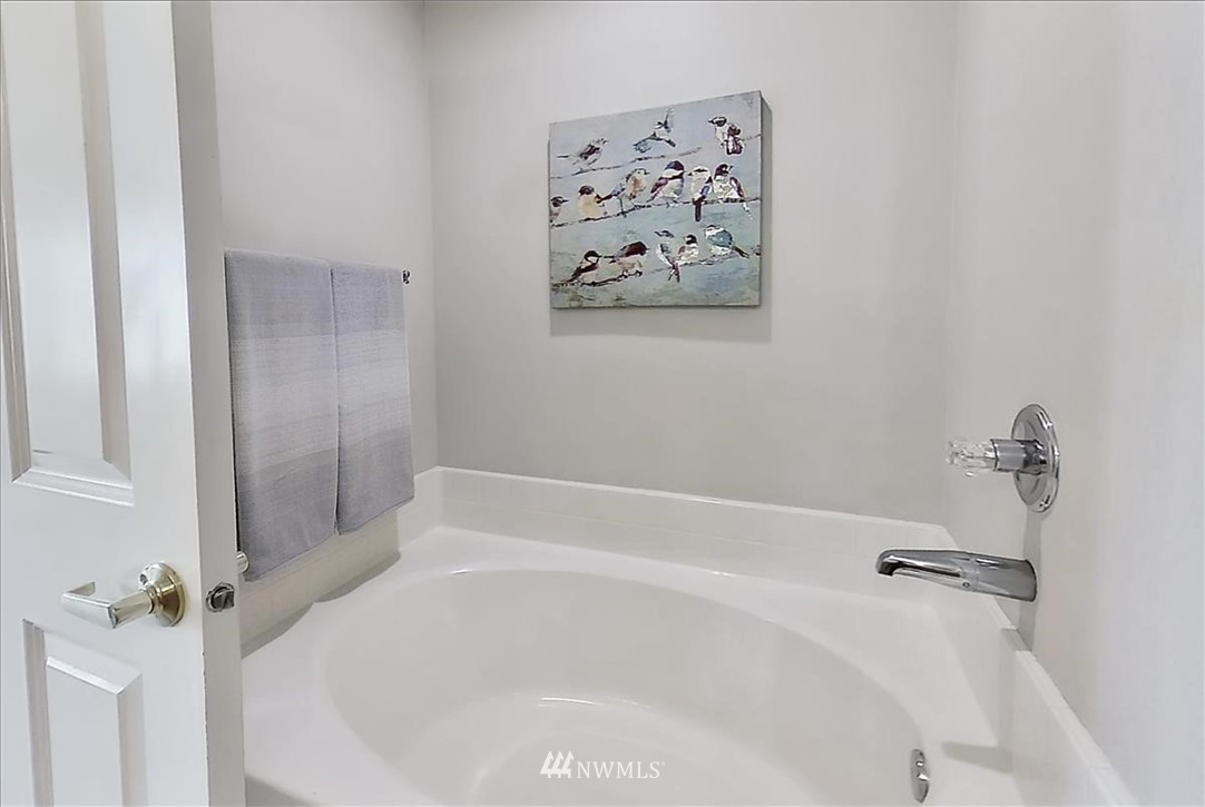 18346 Rainier View Road Southeast Monroe, WA 98272 - Photo 23 of 40 a white bath tub sitting next to a white sink