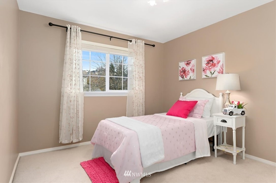 18346 Rainier View Road Southeast Monroe, WA 98272 - Photo 26 of 40 a bedroom with a bed and a window