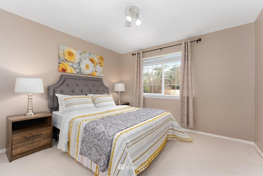 18346 Rainier View Road Southeast Monroe, WA 98272 - Photo 28 of 40 a bedroom with a bed and a window