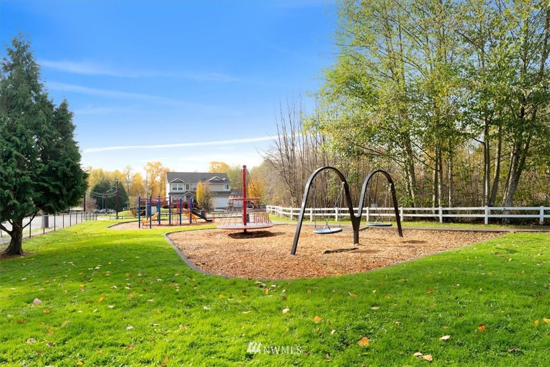 18346 Rainier View Road Southeast Monroe, WA 98272 - Photo 40 of 40 a swimming pool with lots of tress in front of it