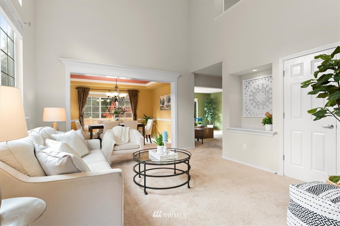 18346 Rainier View Road Southeast Monroe, WA 98272 - Photo 5 of 40 a living room with furniture and a large window