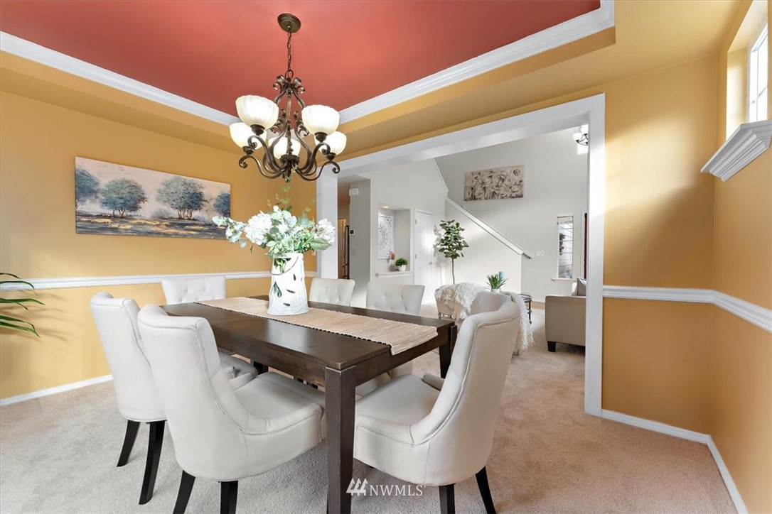 18346 Rainier View Road Southeast Monroe, WA 98272 - Photo 7 of 40 a view of a dining room with furniture and chandelier