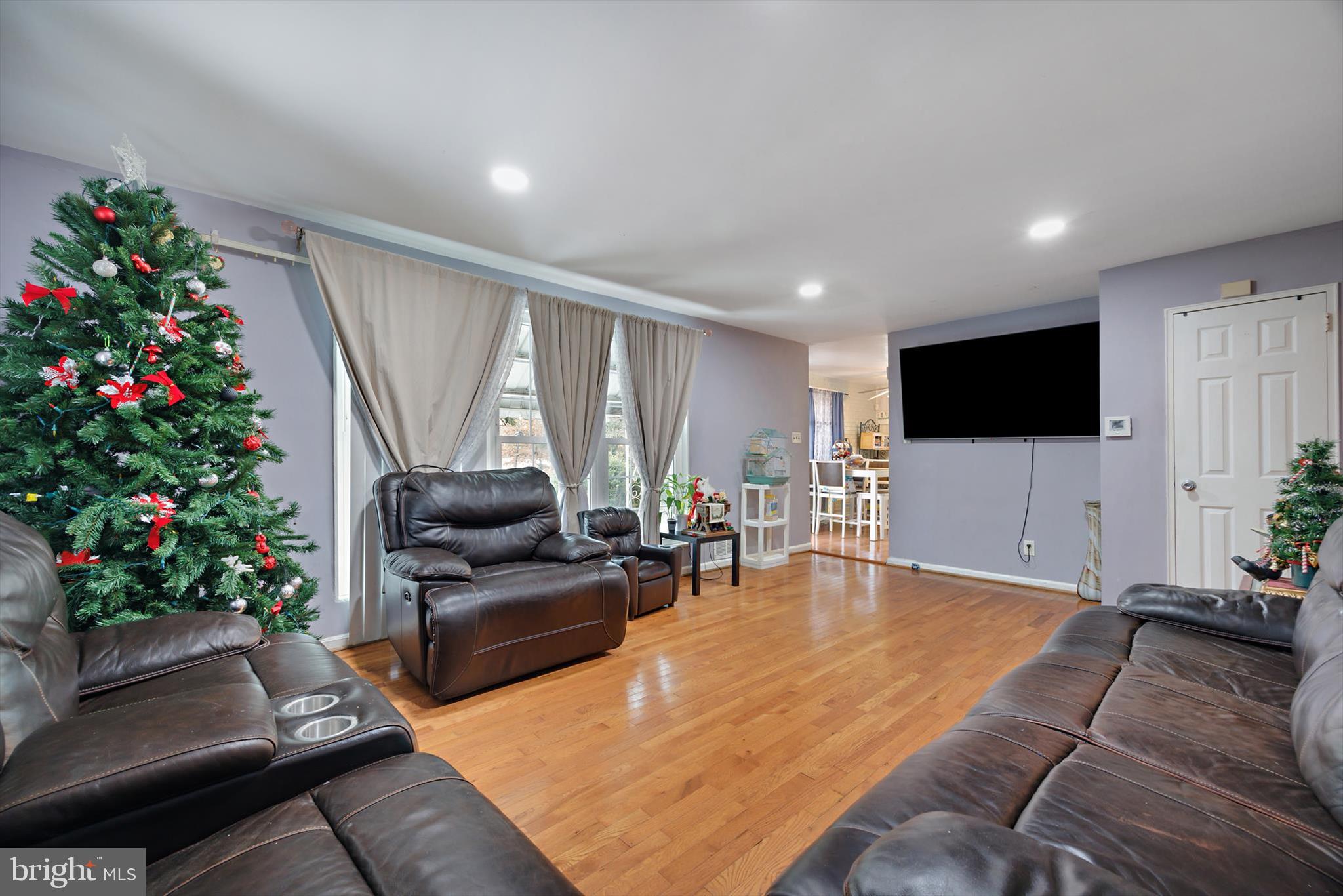 5401 Kenmont Road Oxon Hill, MD 20745 - Photo 13 of 39 a living room with furniture and a flat screen tv