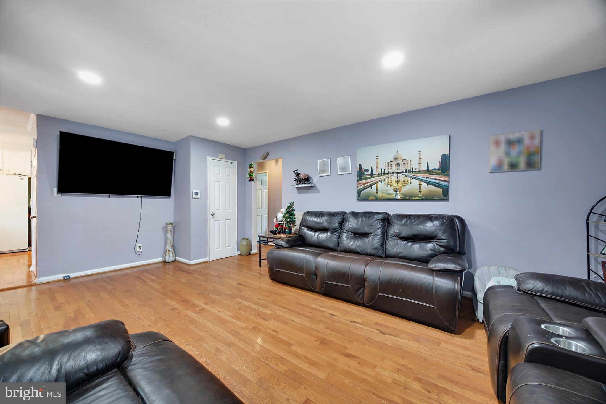 5401 Kenmont Road Oxon Hill, MD 20745 - Photo 14 of 39 a living room with furniture and a flat screen tv