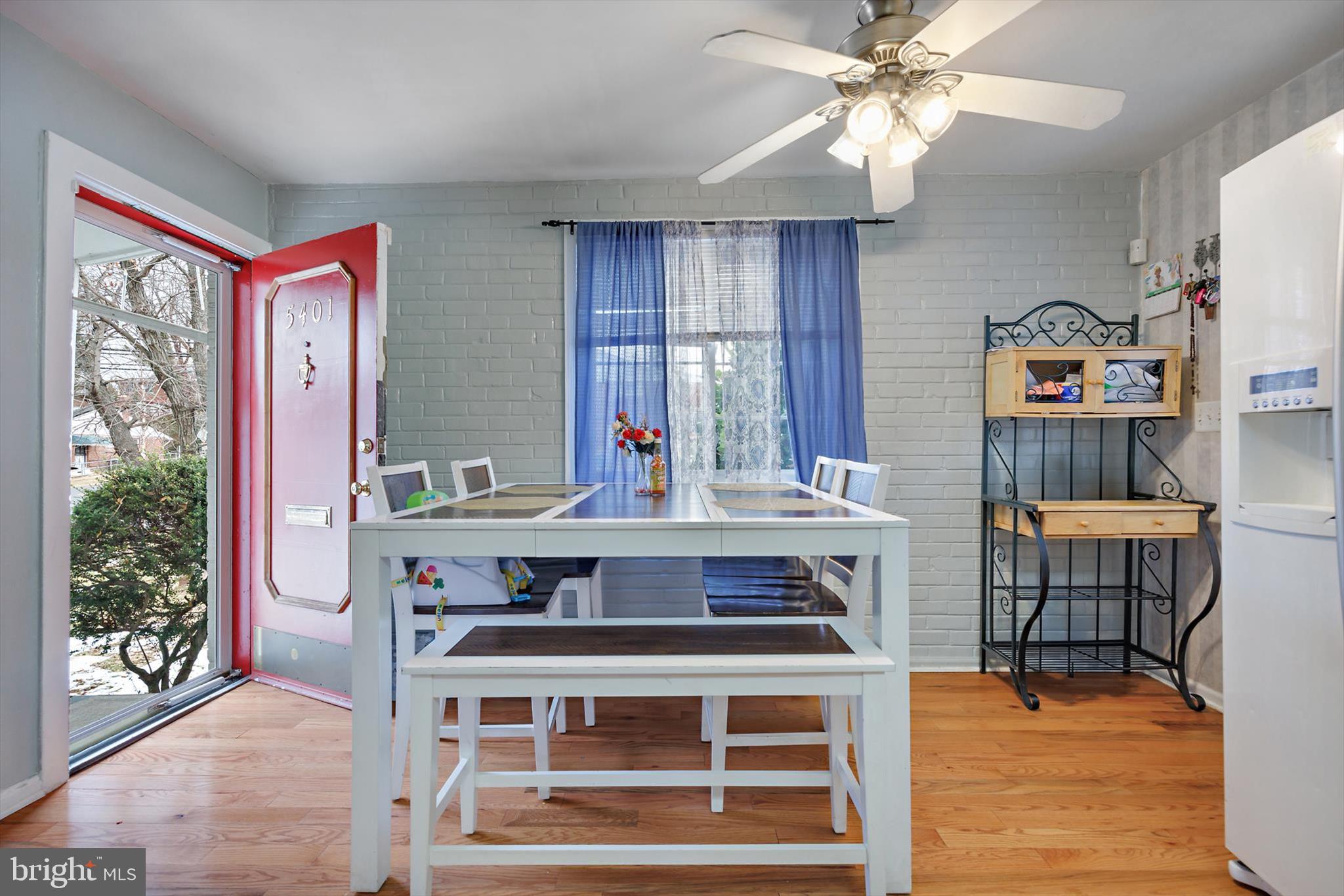 5401 Kenmont Road Oxon Hill, MD 20745 - Photo 6 of 39 a view of a dining room with furniture window and wooden floor