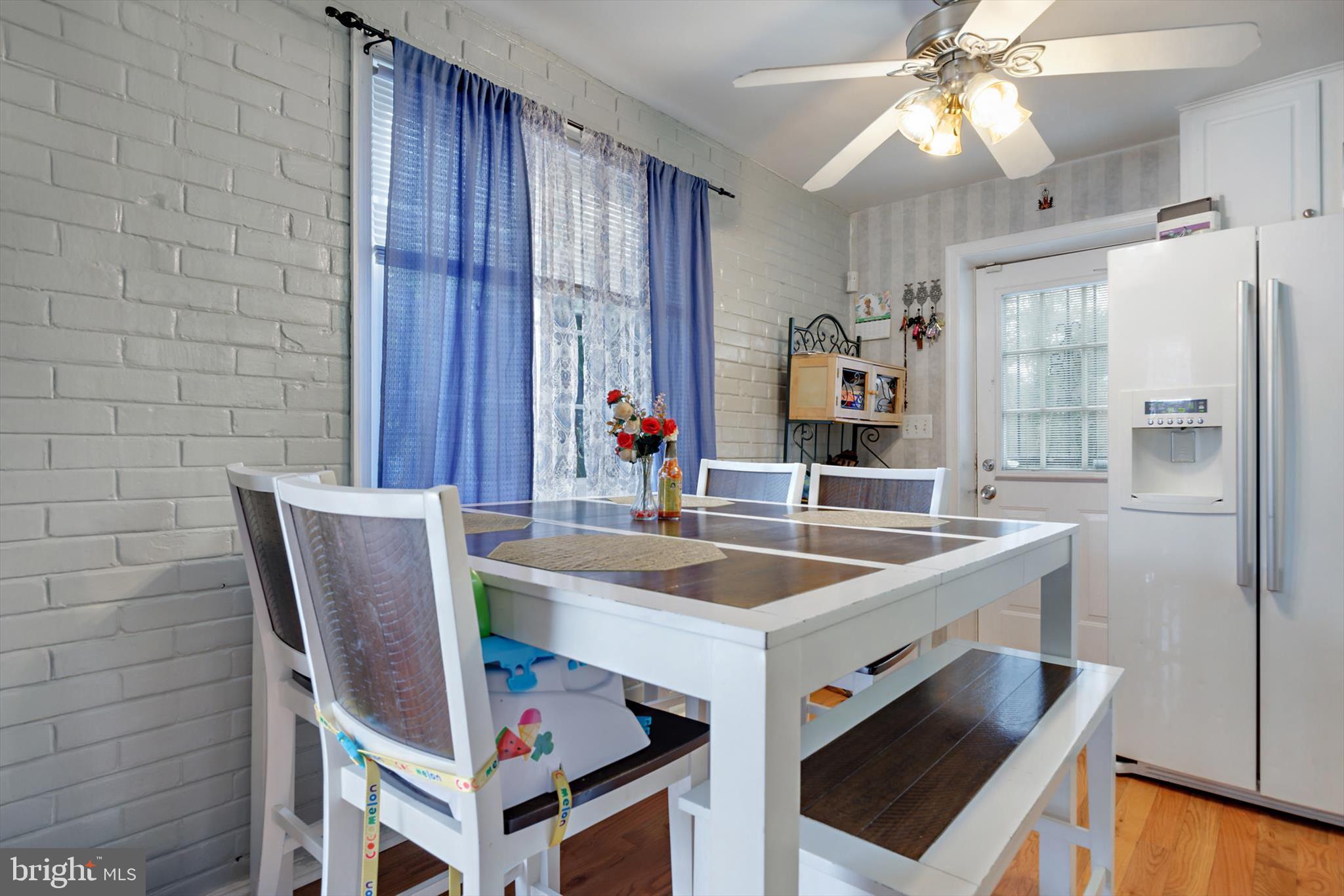 5401 Kenmont Road Oxon Hill, MD 20745 - Photo 7 of 39 a view of a kitchen area with furniture and chandelier