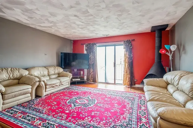 a living room with furniture and a rug