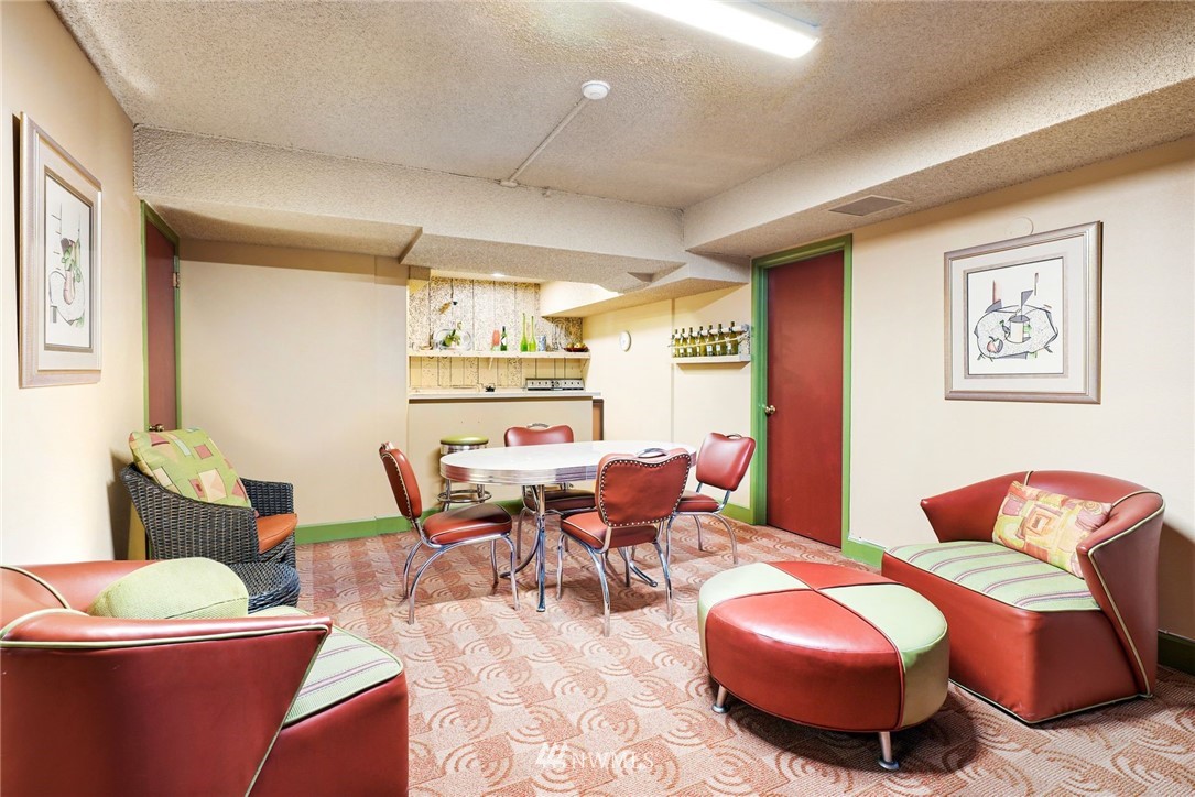 507 West Mercer Street, Unit 603 Seattle, WA 98119 - Photo 17 of 21 a dining room with furniture and wooden floor