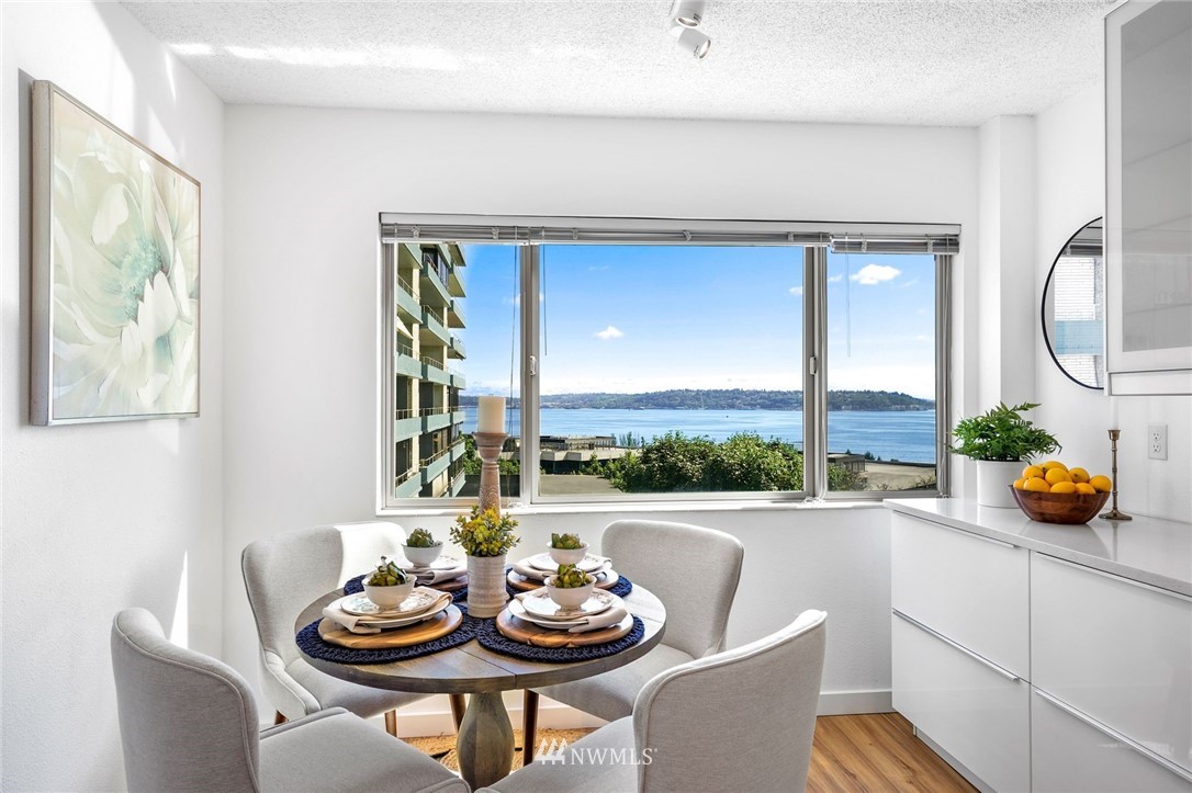 507 West Mercer Street, Unit 603 Seattle, WA 98119 - Photo 7 of 21 a view of a dining room with furniture window and flowerpot