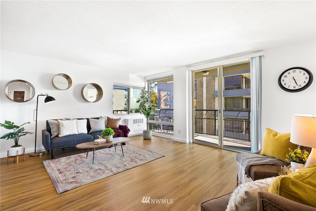 507 West Mercer Street, Unit 603 Seattle, WA 98119 - Photo 10 of 21 a living room with furniture and wooden floor