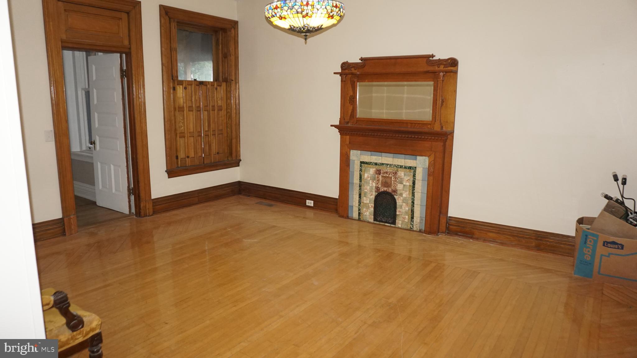 200 East Walnut Street, Unit 1 Hanover, PA 17331 - Photo 12 of 29 a view of an empty room with a fireplace