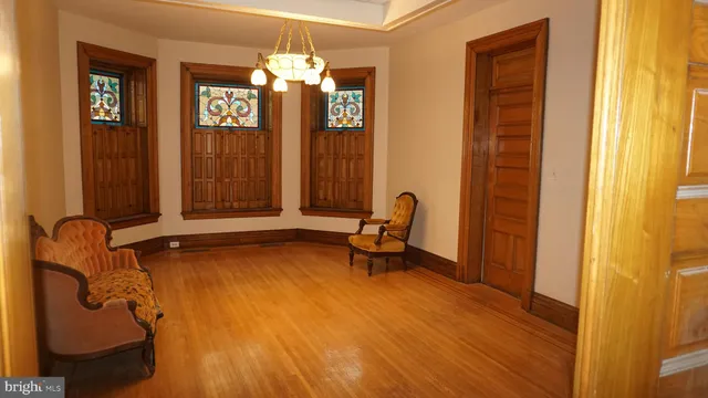 a bedroom with a bed and chair