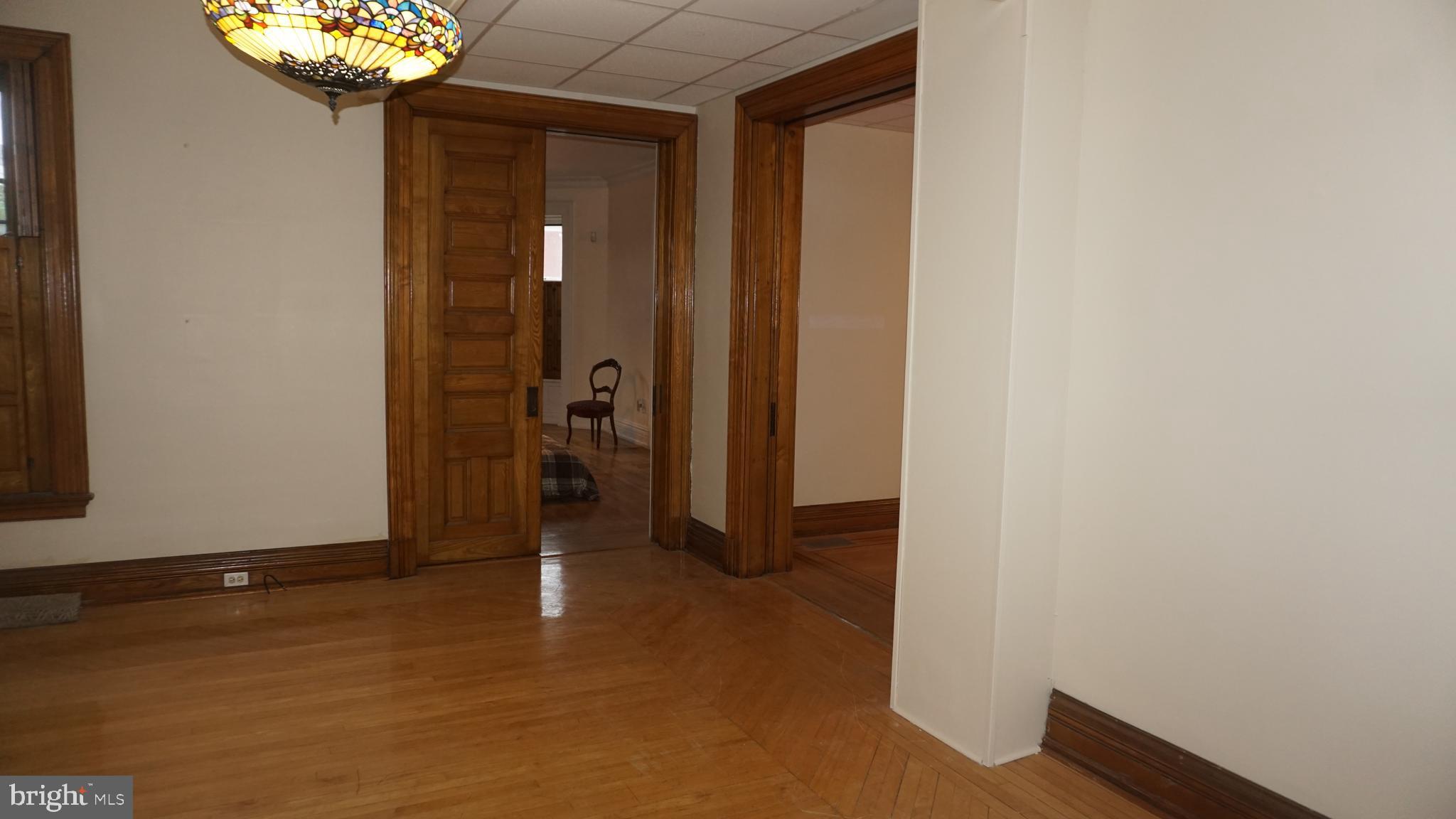 200 East Walnut Street, Unit 1 Hanover, PA 17331 - Photo 26 of 29 a view of a hallway with a chandelier
