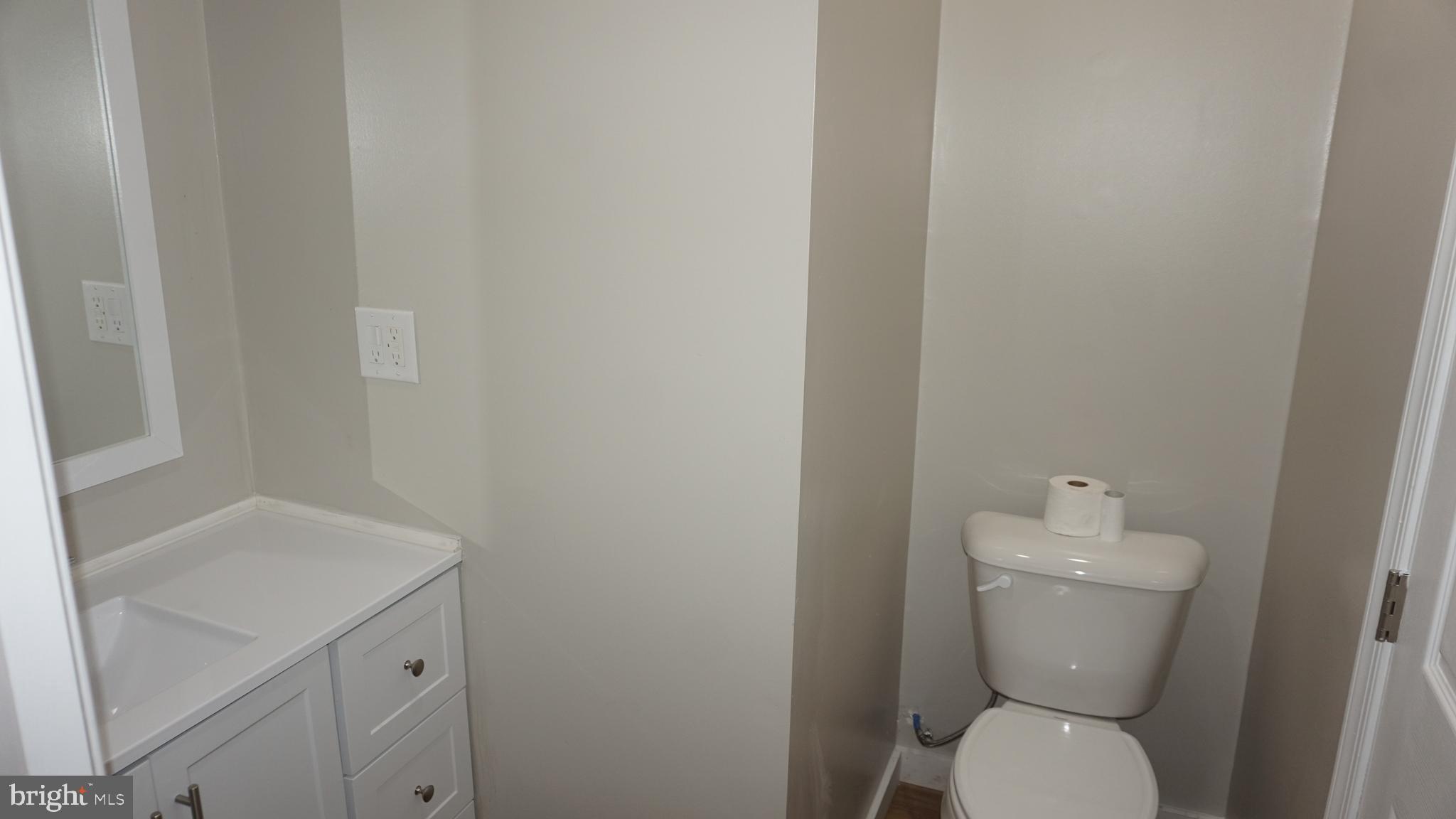 200 East Walnut Street, Unit 1 Hanover, PA 17331 - Photo 6 of 29 a white toilet sitting next to a white sink
