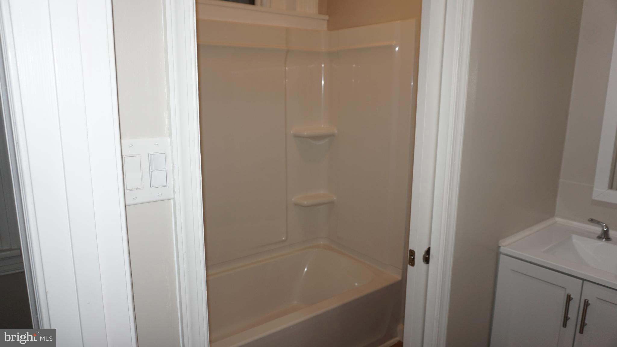 200 East Walnut Street, Unit 1 Hanover, PA 17331 - Photo 7 of 29 a bathroom with a bathtub