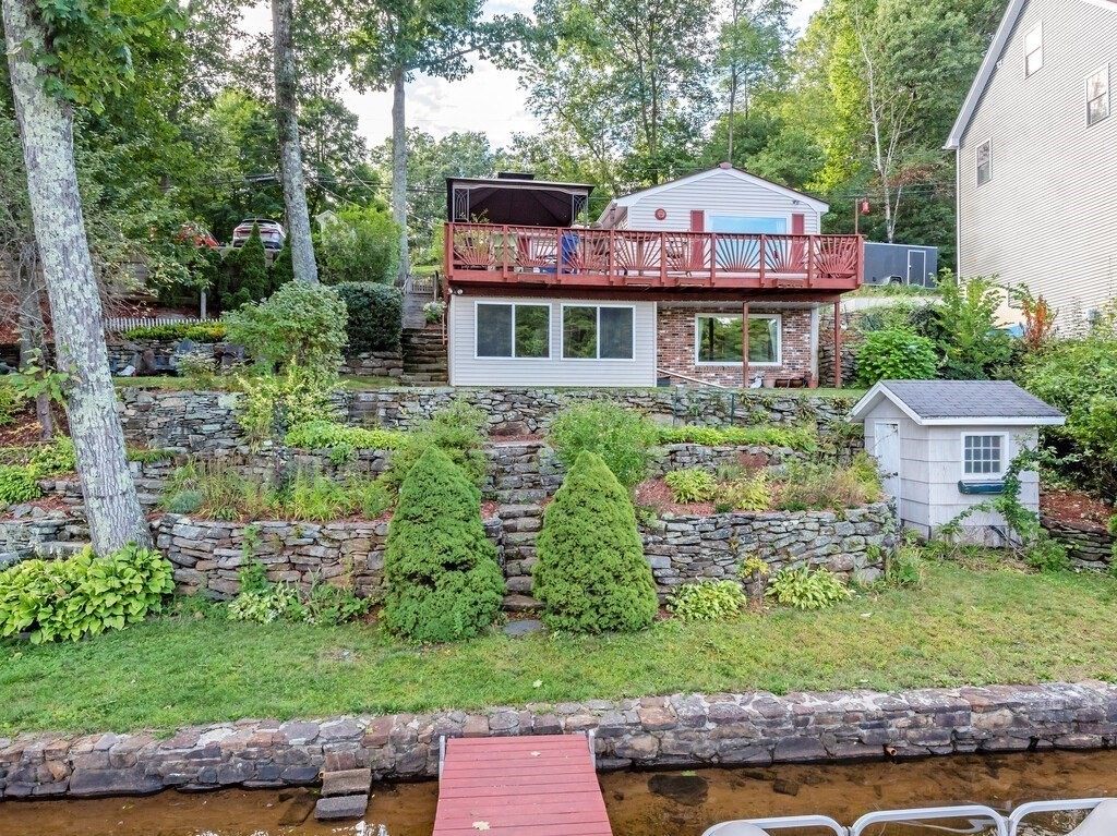 97 Sandy Beach Road Holland, MA 01521 - Photo 2 of 41 a front view of a house with garden