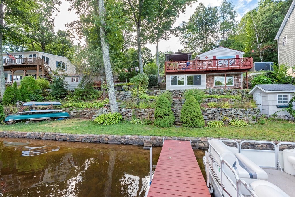 97 Sandy Beach Road Holland, MA 01521 - Photo 3 of 41 a front view of a house with a yard