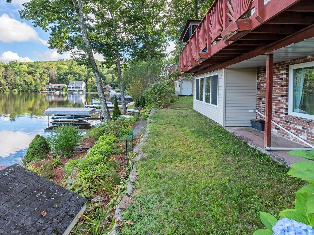 97 Sandy Beach Road Holland, MA 01521 - Photo 8 of 41 a view of backyard of house with green space