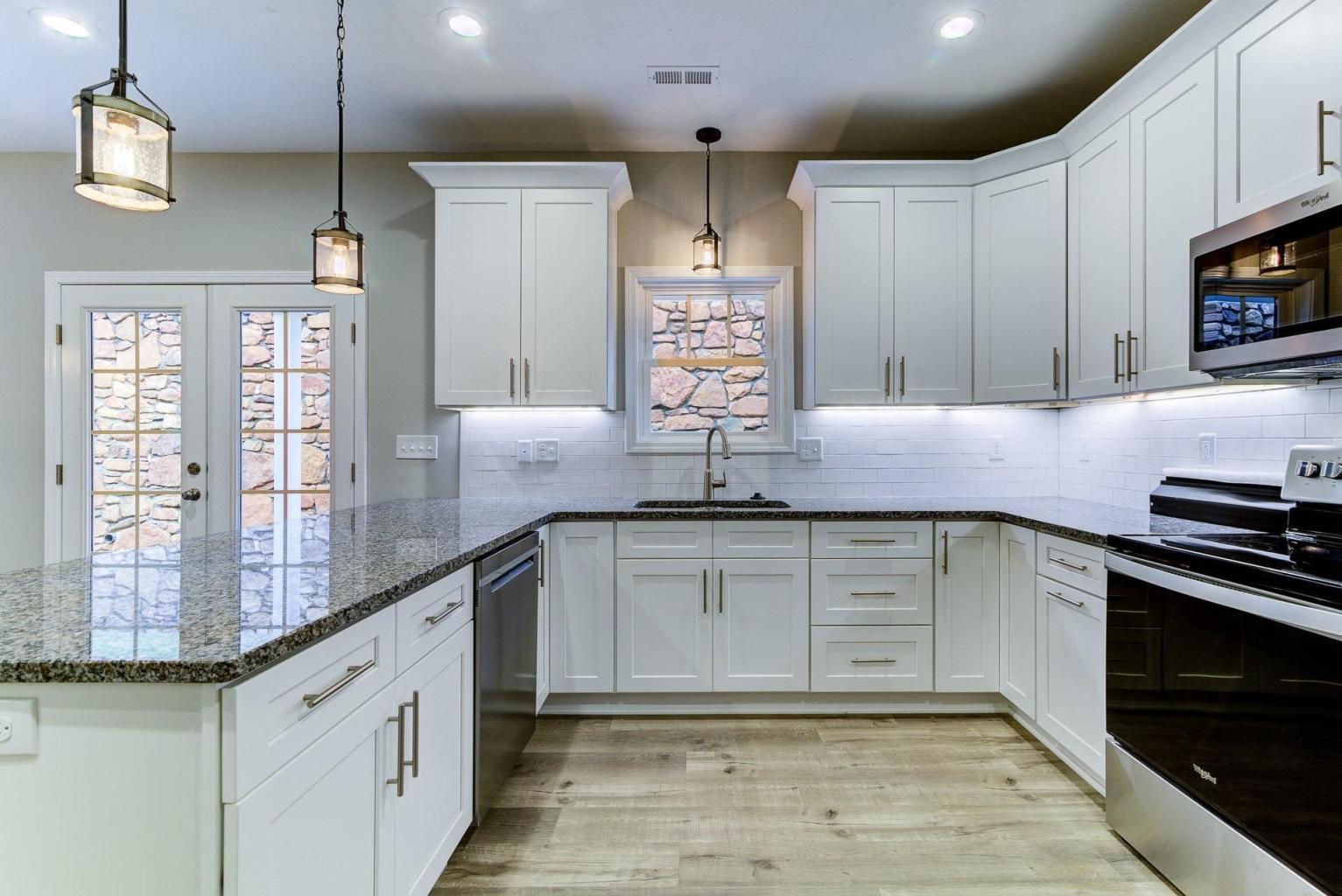 4257 Daugherty Road Salem, VA 24153 - Photo 14 of 37 a kitchen with granite countertop cabinets and stainless steel appliances