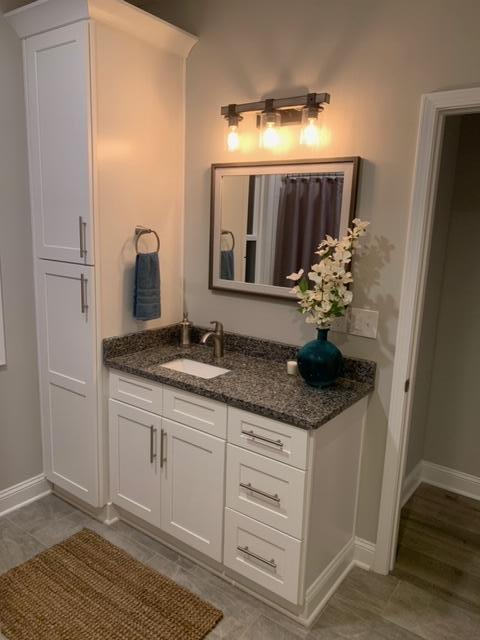 4257 Daugherty Road Salem, VA 24153 - Photo 20 of 37 a bathroom with a granite countertop sink and a mirror