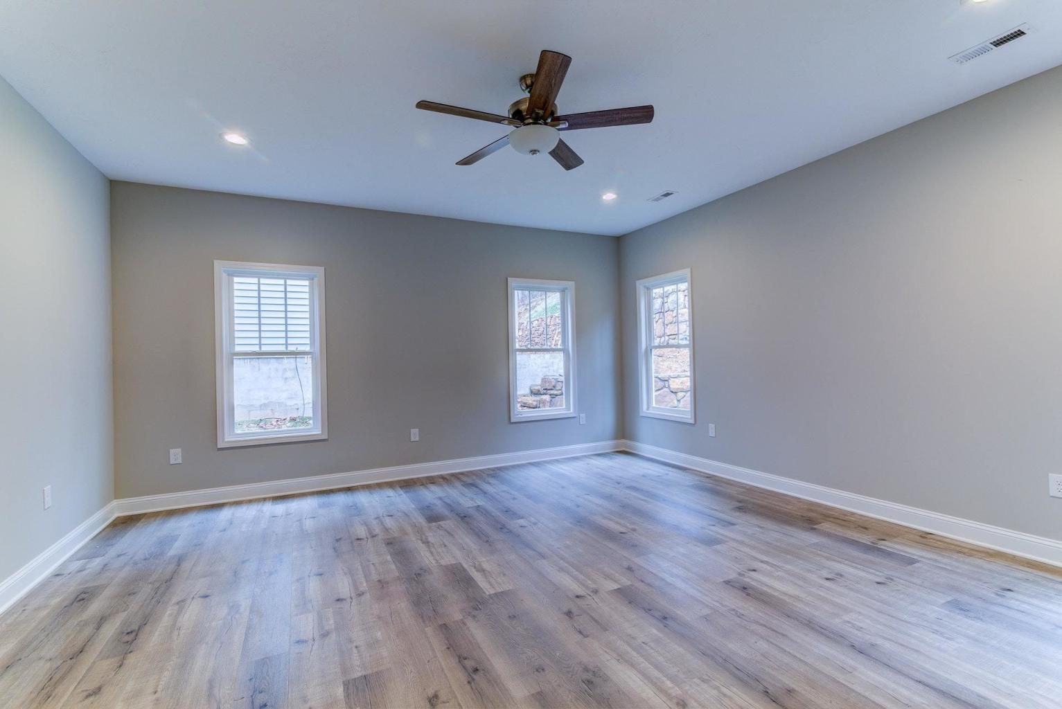 4257 Daugherty Road Salem, VA 24153 - Photo 23 of 37 a view of an empty room with a window and wooden floor