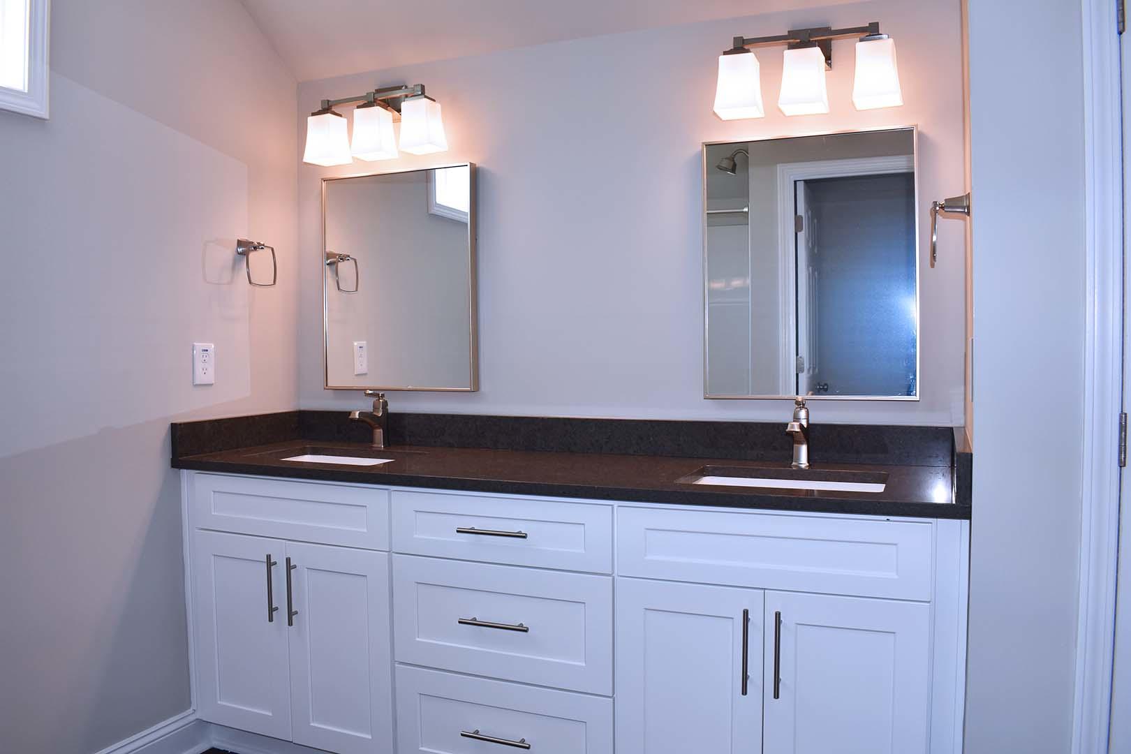 4257 Daugherty Road Salem, VA 24153 - Photo 30 of 37 a bathroom with double sink and a mirror