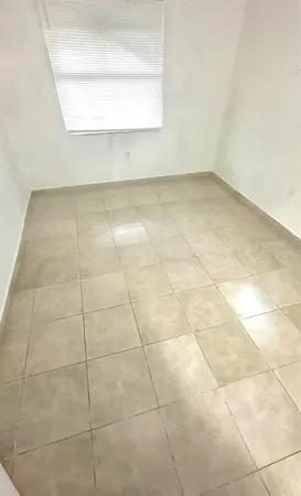 a view of a room that has a window in it