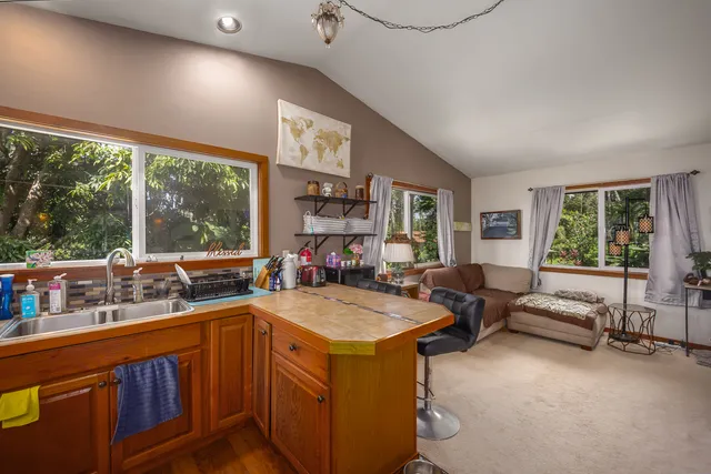 a view of living room with furniture and window