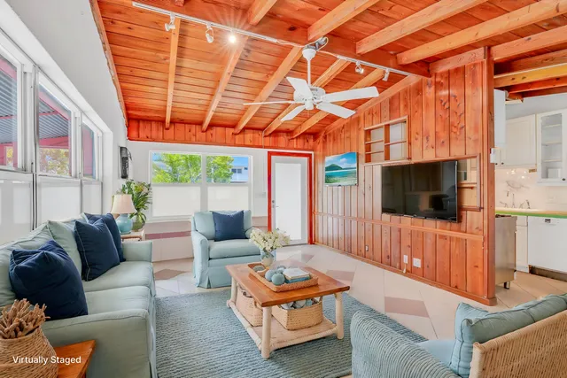 a backyard of a house with outdoor seating