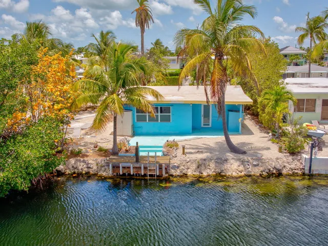 a view of a backyard of a house