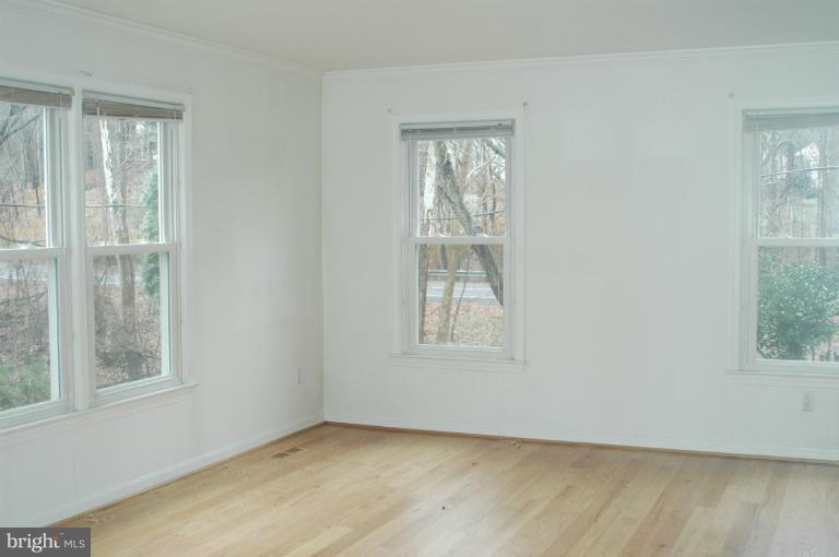 9914 Meadowlark Road Vienna, VA 22182 - Photo 4 of 10 an empty room with windows