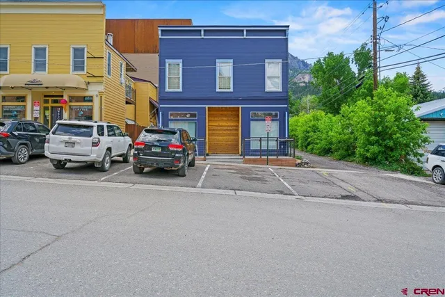 a houses on the side of a street