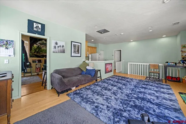 a bedroom with furniture and a rug